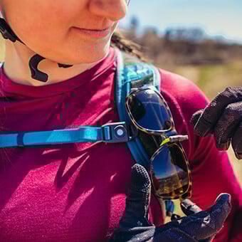 Sunglass QuickStow system on shoulder harness for quick, secure and scratch-free access