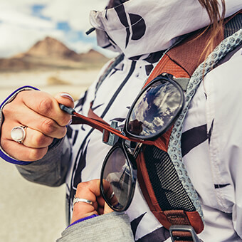 Sunglass QuickStow system on shoulder harness