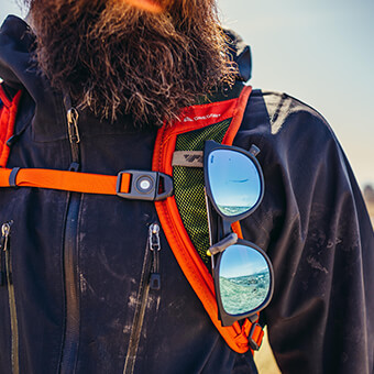 Sunglass QuickStow system on shoulder harness for quick, secure and scratch-free access