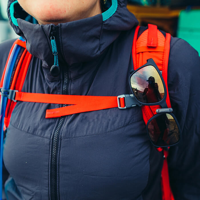 Sunglass QuickStow system on shoulder harness for quick, secure and scratch-free access to your shades without taking the pack off