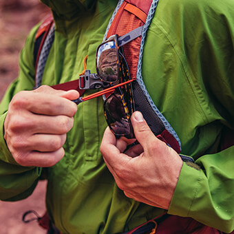 Sunglass QuickStow system on shoulder harness