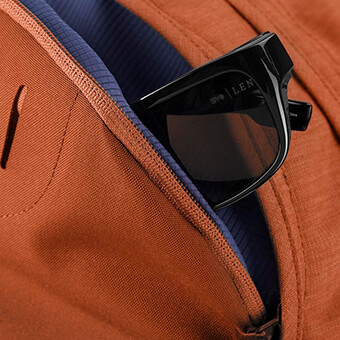Soft touch zippered pocket for electronics or sunglasses