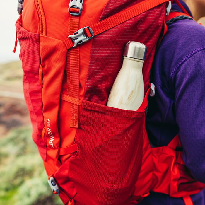 Dual side stretch mesh pockets for easy access to a water bottle