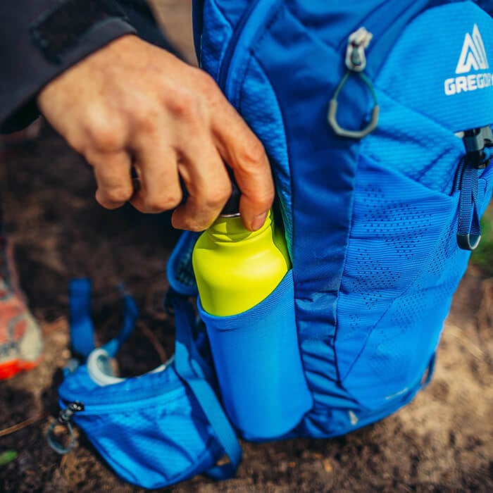 Front and side stretch mesh pockets for quick access to water bottles and an extra layer