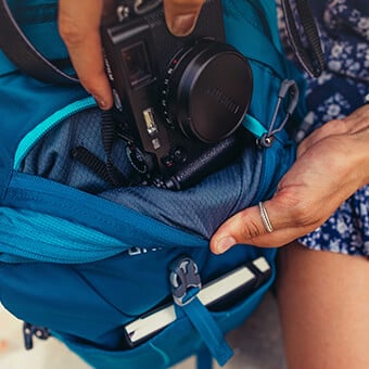 Top quick access pocket with soft-touch liner
