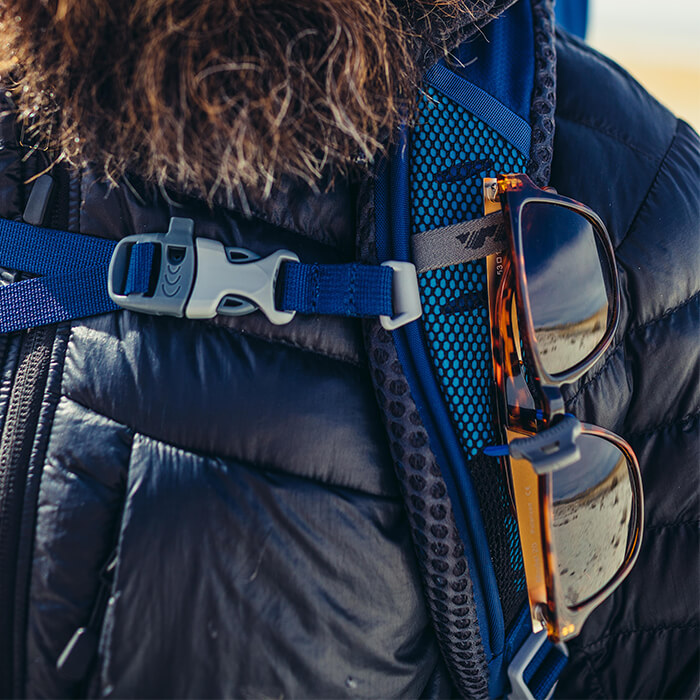 Sunglass QuickStow system - Sunglass QuickStow system on shoulder harness for quick, secure and scratch-free access to our shades without taking the pack off