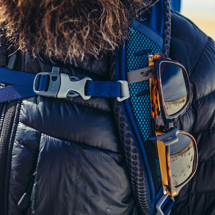 Sunglass QuickStow system - Sunglass QuickStow system on shoulder harness for quick, secure and scratch-free access to our shades without taking the pack off