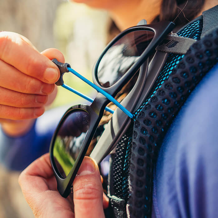 Sunglass QuickStow system - Sunglass QuickStow system on shoulder harness for quick, secure and scratch-free access to our shades without taking the pack off